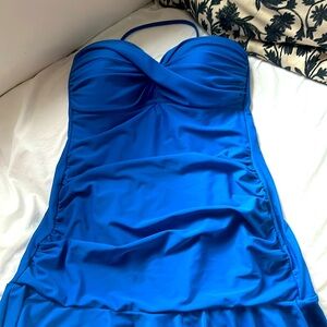 One piece Royal blue bathing suit with flattering ruffle on the bottom.